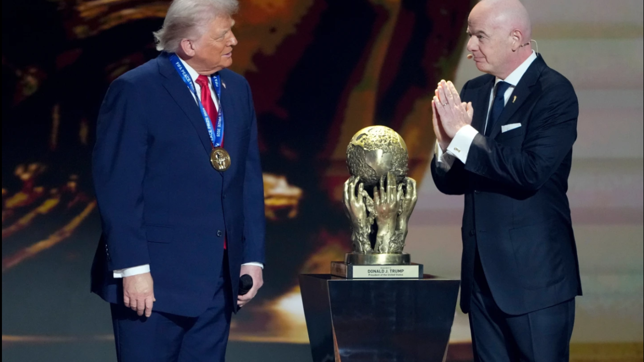 FIFA President Gianni Infantino, right, awards President Donald Trump with the FIFA Peace Prize during the draw for the 2026 soccer World Cup at the Kennedy Center in Washington, Friday, Dec. 5, 2025.