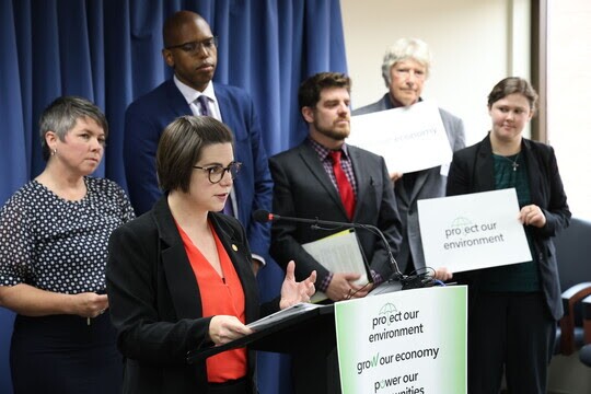 Rep Laurie Pohutsky (D-Livonia) speaks about her clean energy legislation with advocates around her. Included is the Environmental Council's Carlee Knott, far left. (Photo courtesy of House Dems).jpg