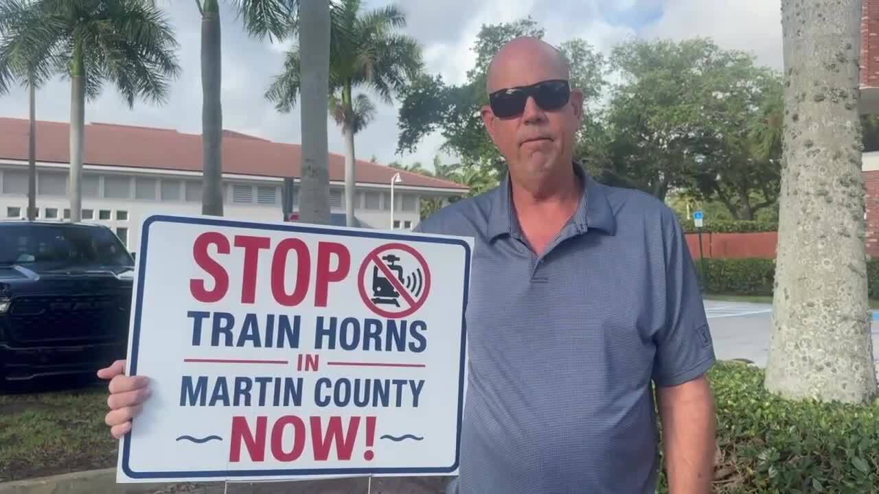 resident with stop train horns sign in Martin County May 19 2026.jpg