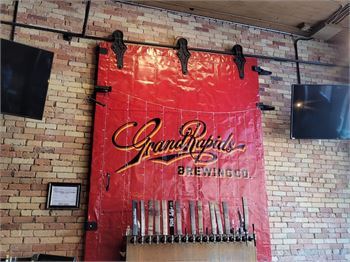 Grand Rapids Brewing Company - red metal barn door sign