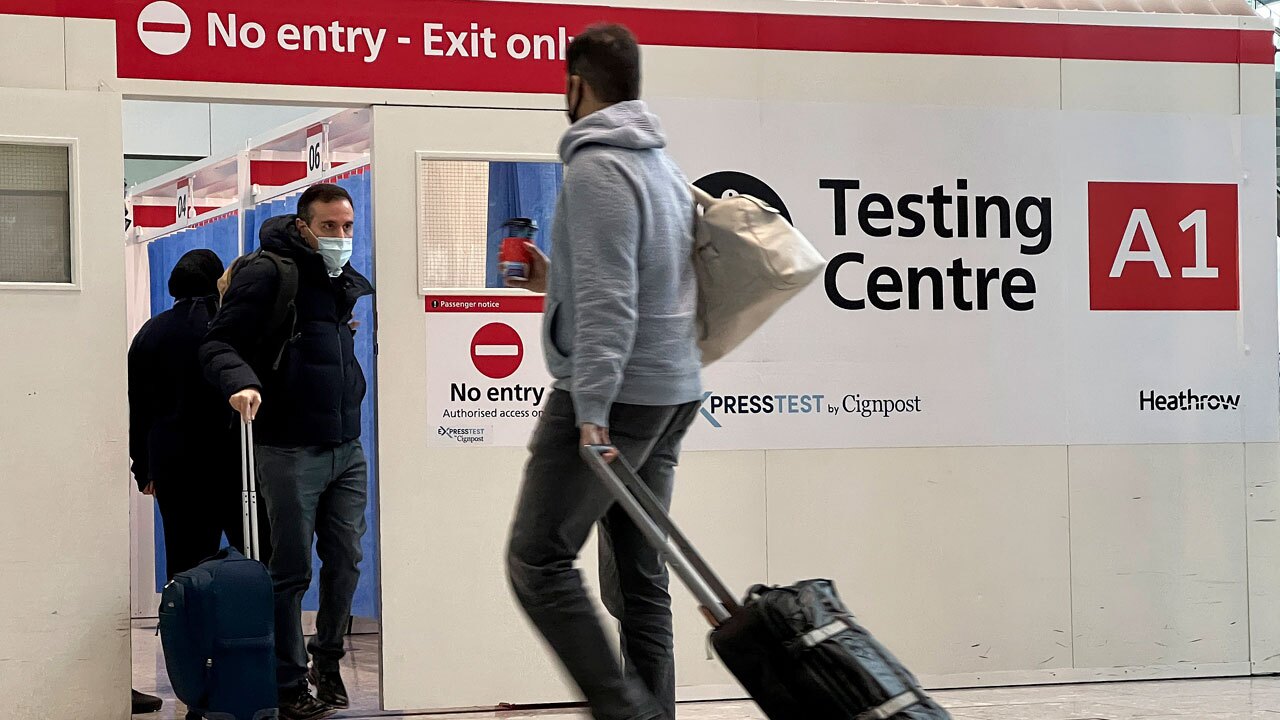 Passengers get a COVID-19 test at a Testing Centre at Heathrow Airport in London, Monday, Nov. 29, 2021