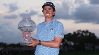 Nico Echavarria of Colombia holds the Cognizant Classic Trophy at the end of the final round of the Cognizant Classic golf tournament, Sunday, March 1, 2026, in Palm Beach Gardens, Fla.