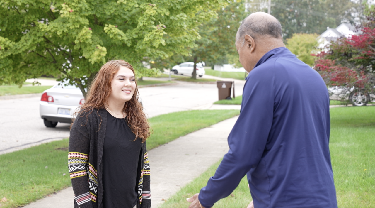 Jazlynn and Milton catch up in the driveway where she stopped to help.