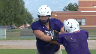 Brody Bulette doing a blocking drill against his teammate, Polson