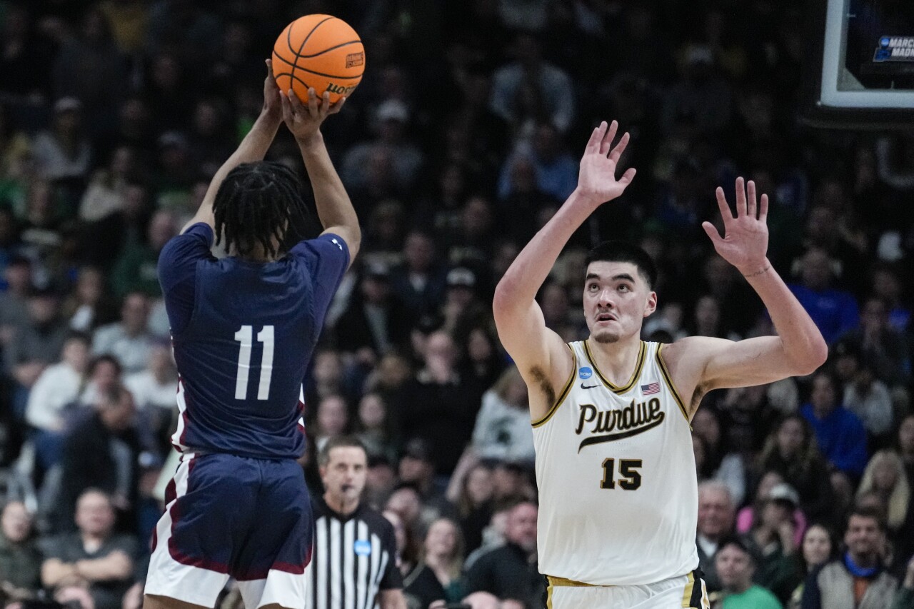 Fairleigh Dickinson Knights forward Sean Moore hits 3-point basket over Purdue center Zach Edey in NCAA tournament, March 17, 2023