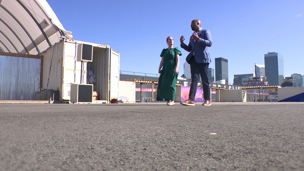 News 5 reporter Michelle Jarboe and Jason Russell of the North Coast Waterfront Development Corporation walk through the North Coast Yard on the downtown lakefront.