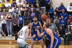 Batavia's Nate Watson (left) in the season opener against Williamsburg. (Photo by Ashly DeTellem)