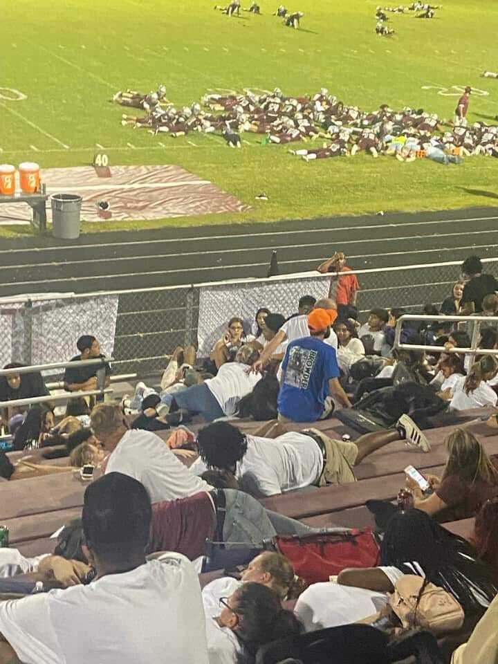 students take cover after gunfire at Clarksville HS football game