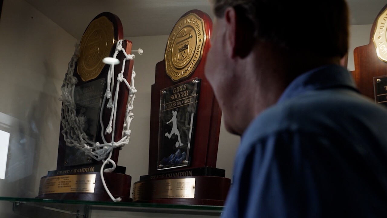 looking at trophy case.jpg