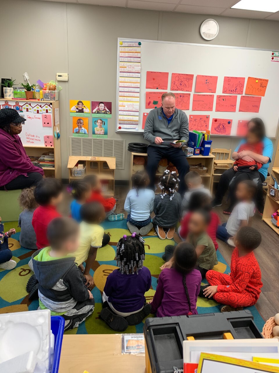 mark stoops reading to kids