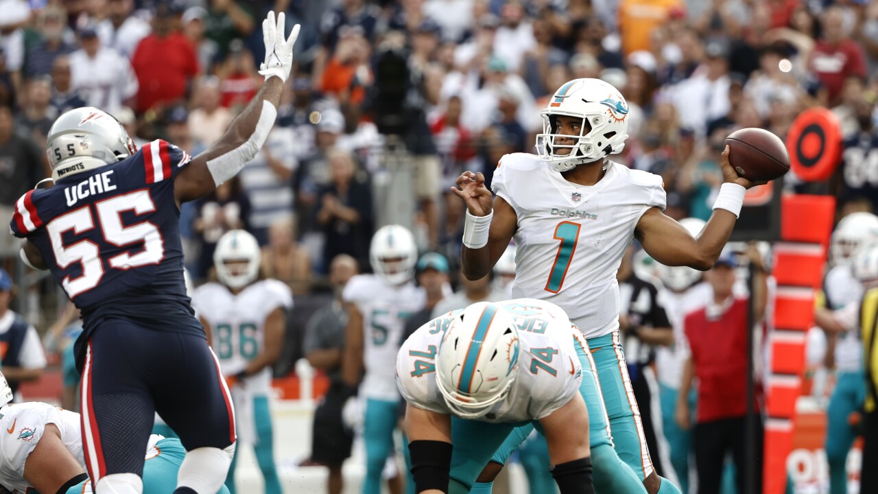 Miami Dolphins QB Tua Tagovailoa passes at New England Patriots in 2021