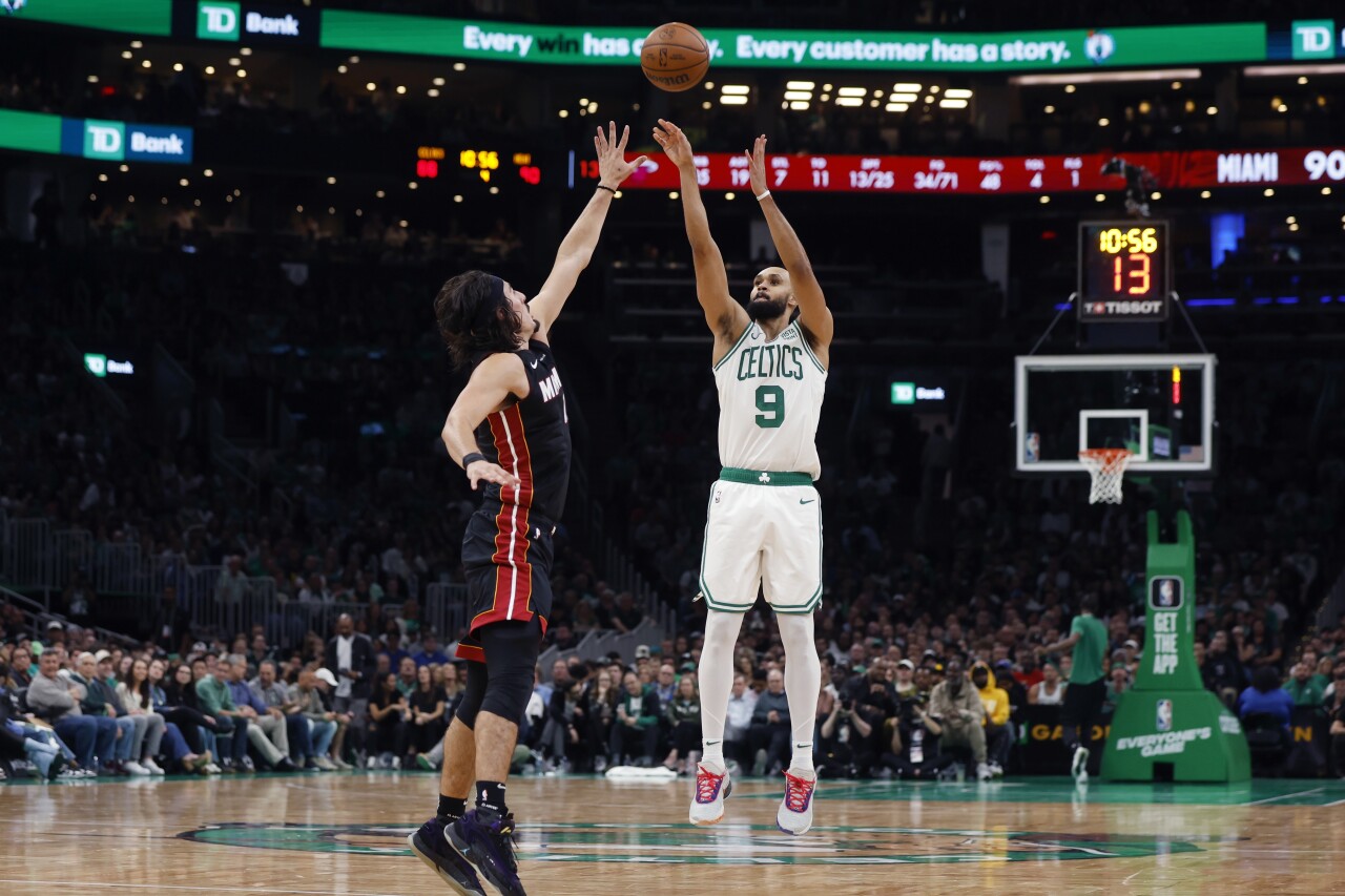 Boston Celtics guard Derrick White shoots over Miami Heat forward Jaime Jaquez Jr. during second half, Oct. 27, 2023