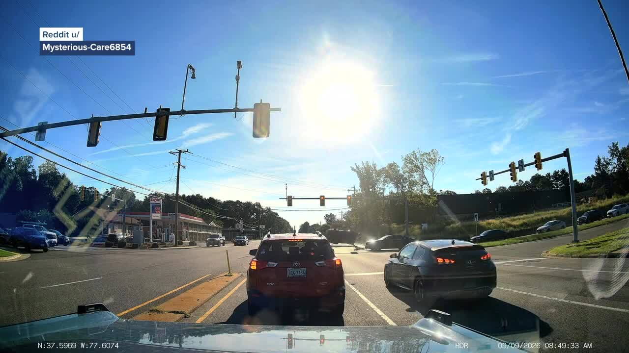 Dashcam video captured a rollover crash at a busy Henrico intersection Wednesday morning after police said an SUV driver ran a red light.