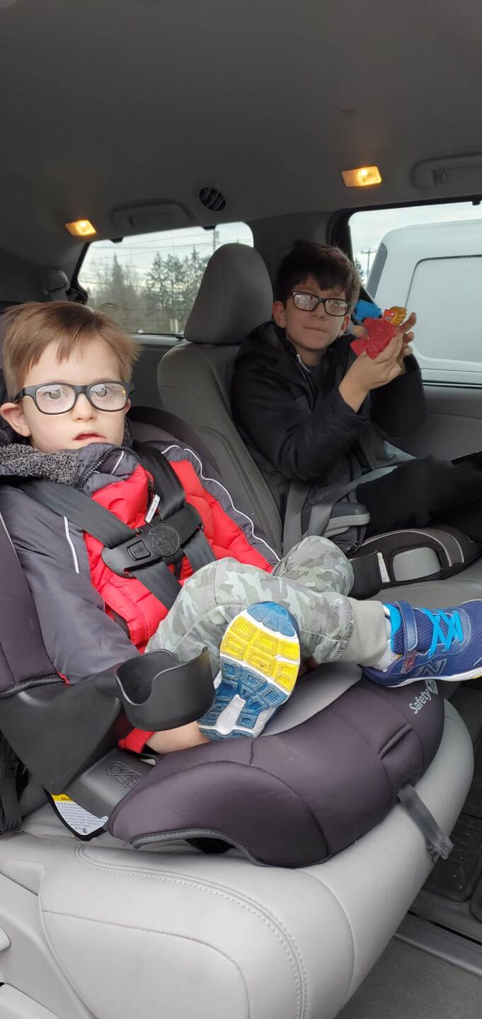 PAUL IN CAR WITH BROTHER.jpg