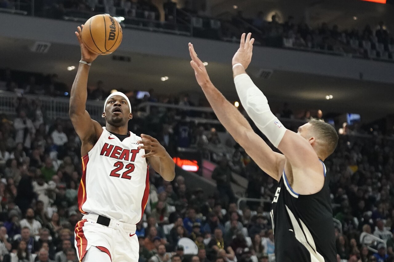Miami Heat forward Jimmy Butler shoots against Milwaukee Bucks center Brook Lopez in Game 2 of NBA first-round playoff series, April 19, 2023