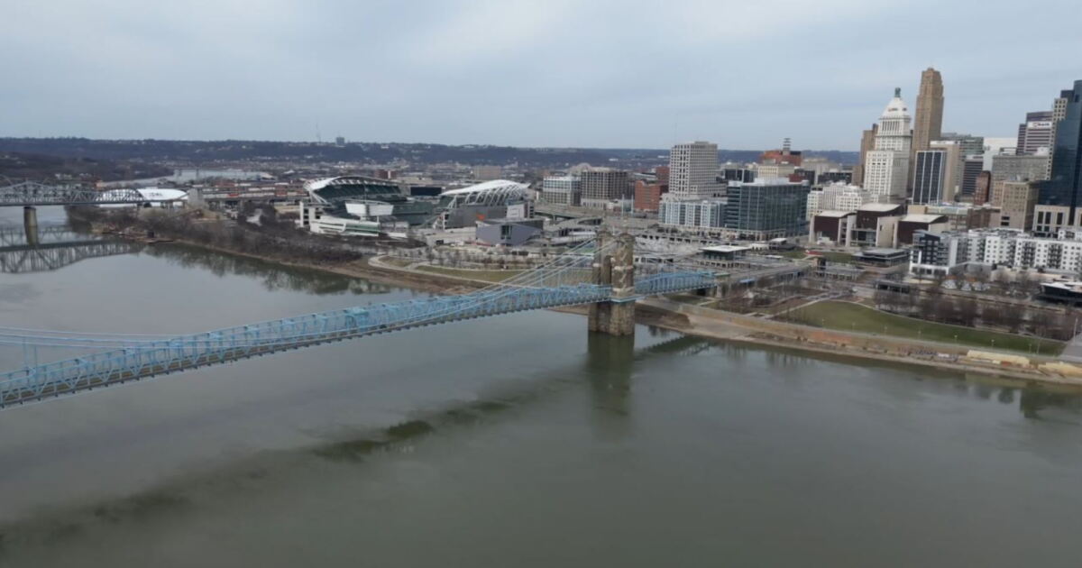 Police investigating after body found floating in Ohio River