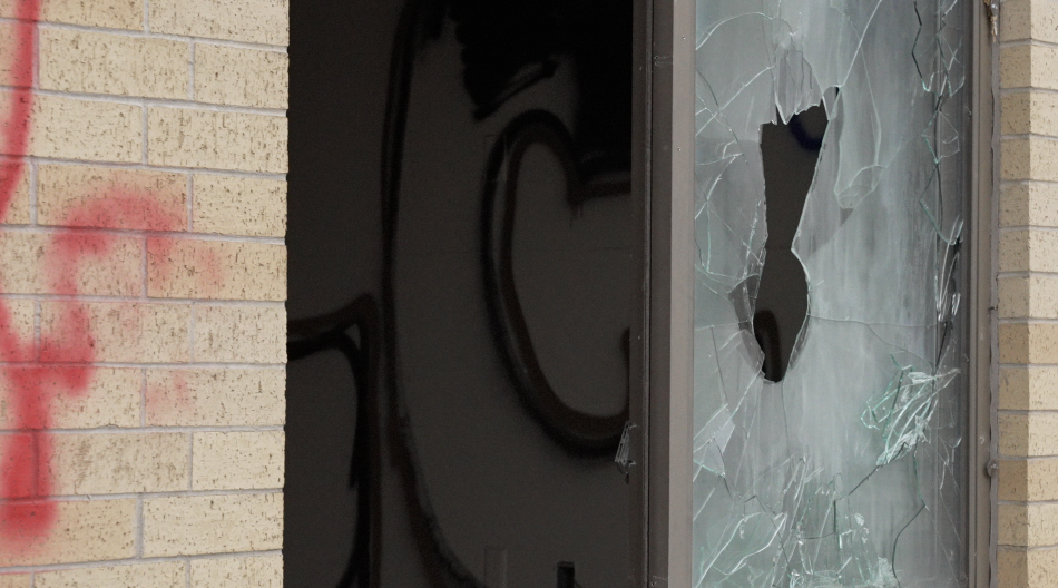 Broken window and graffiti