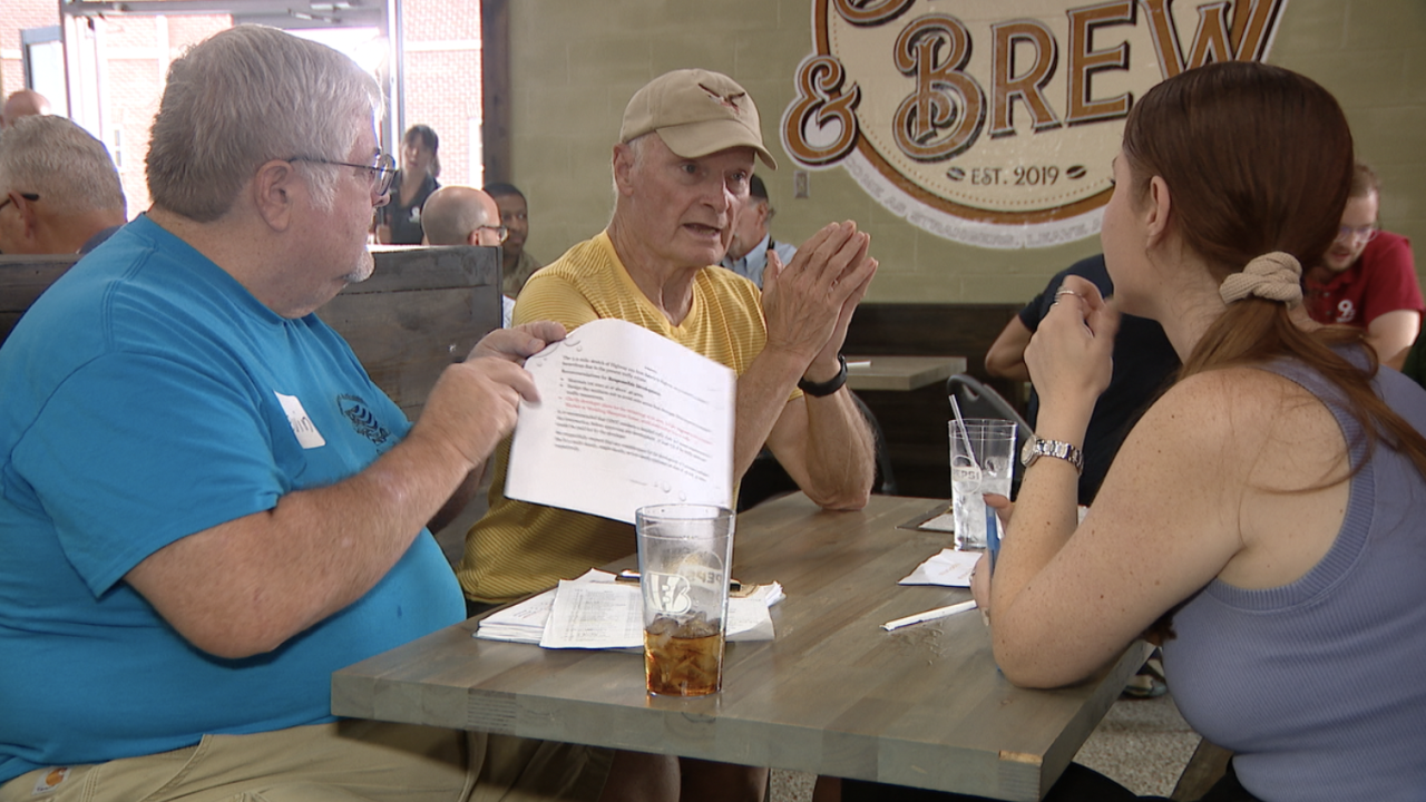 Reporter Valerie Lyons speaks with locals at Let's Talk event