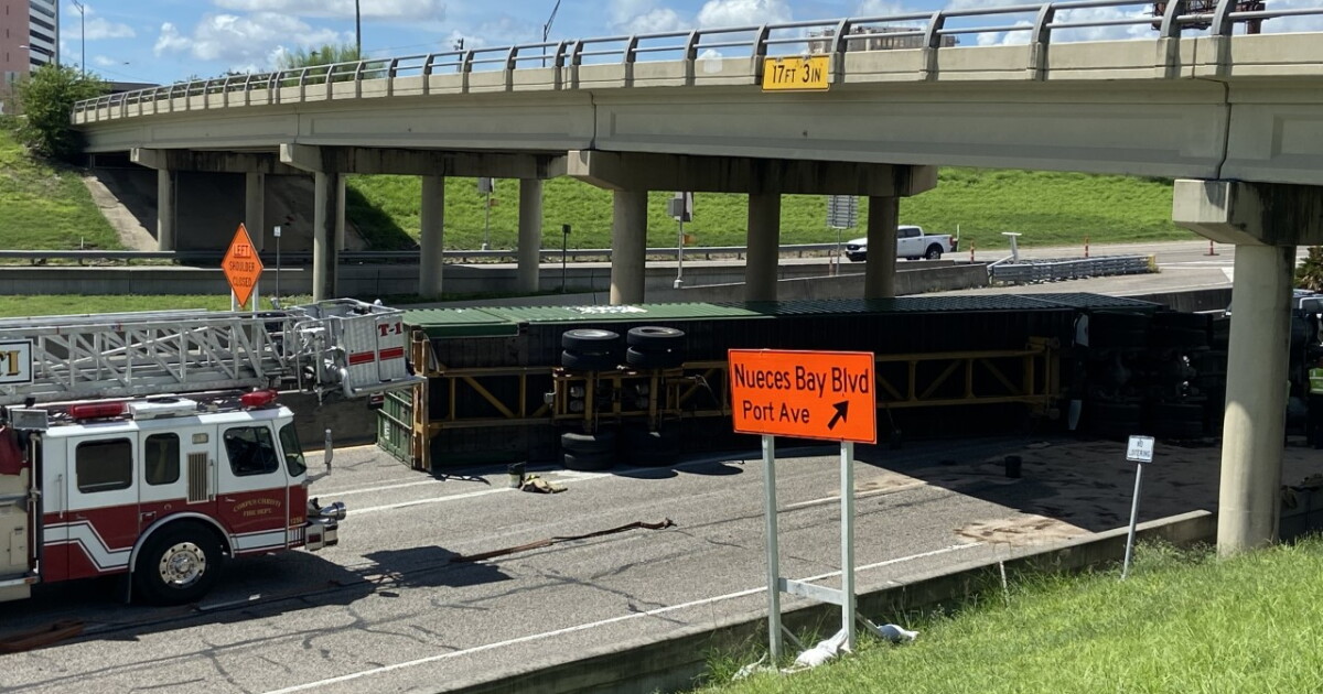 Overturned 18-wheeler causes major traffic delays
