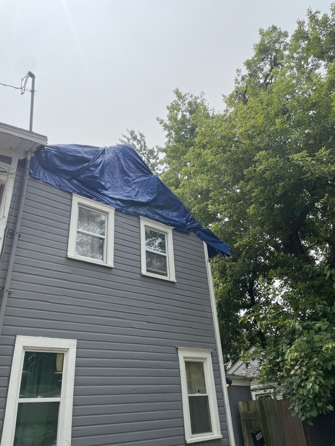 Damage from big branch on Akron home