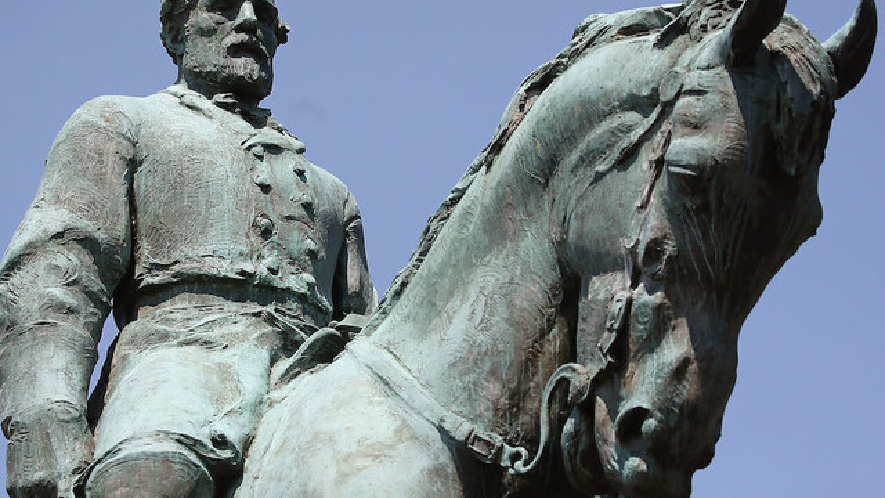 Charlottesville covers Confederate statue in black