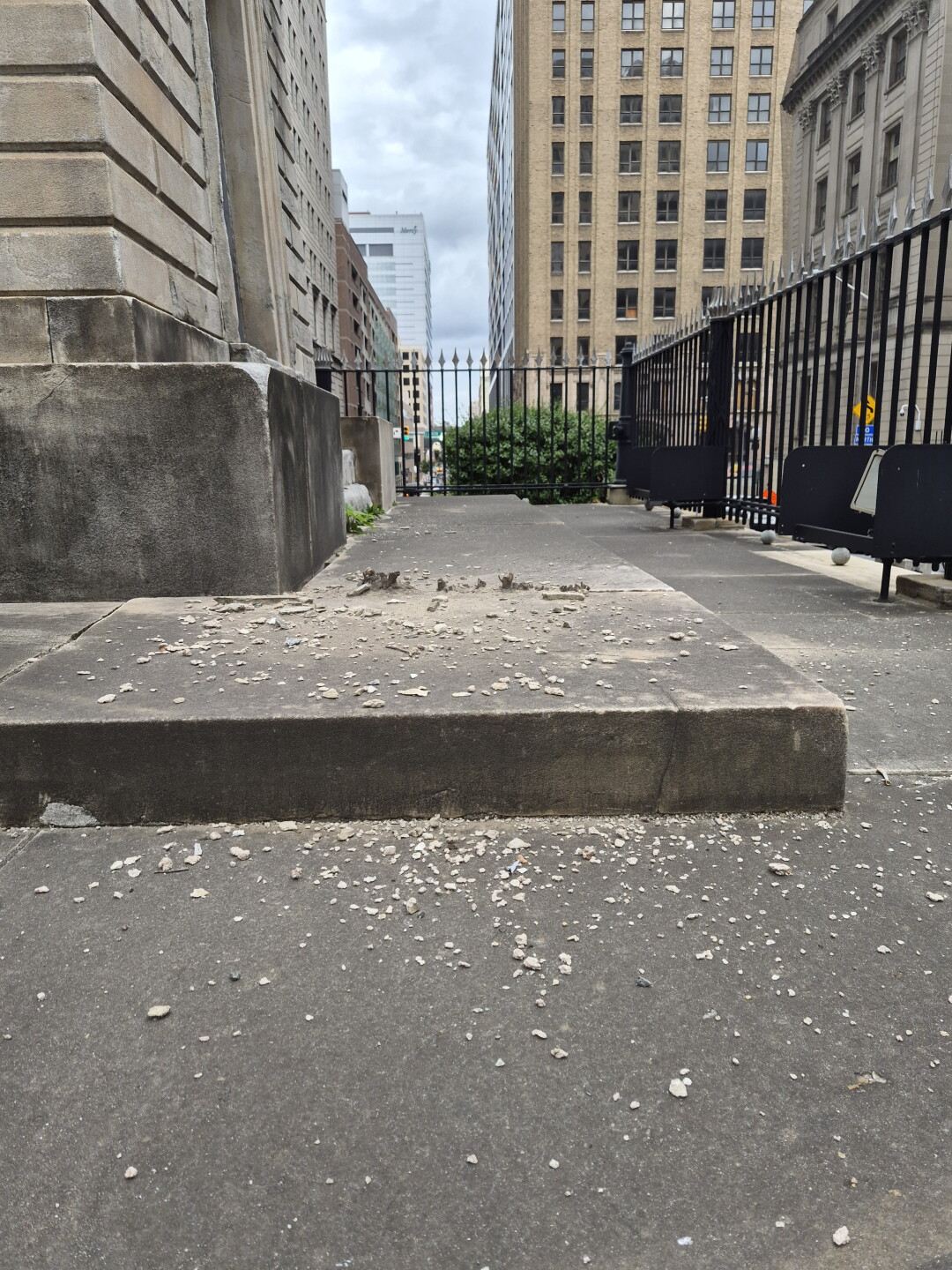 Pieces of the monument lying alongside it