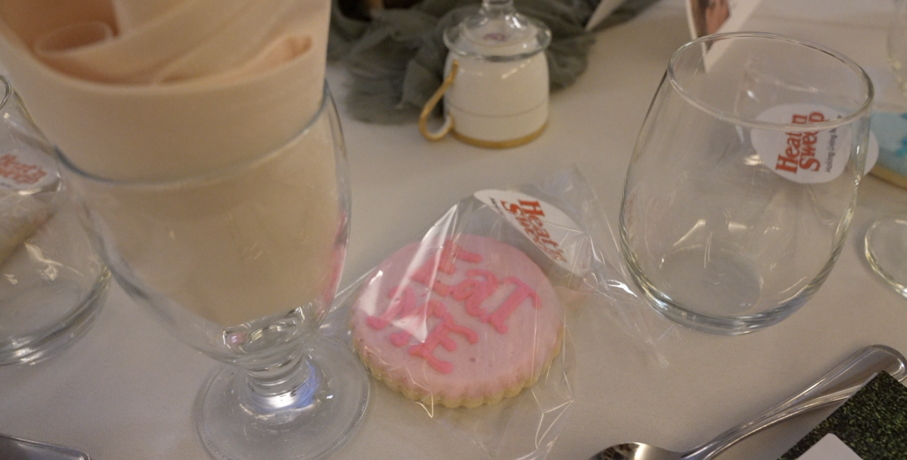 Dinner tables featured cookies reading "Eat me."