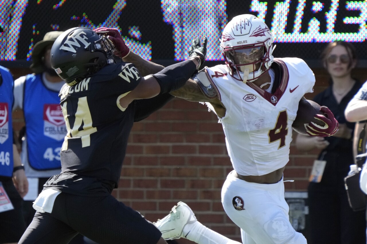 Florida State Seminoles receiver Keon Coleman pushes past Wake Forest Demon Deacons safety Evan Slocum for TD in second quarter, Oct. 28, 2023