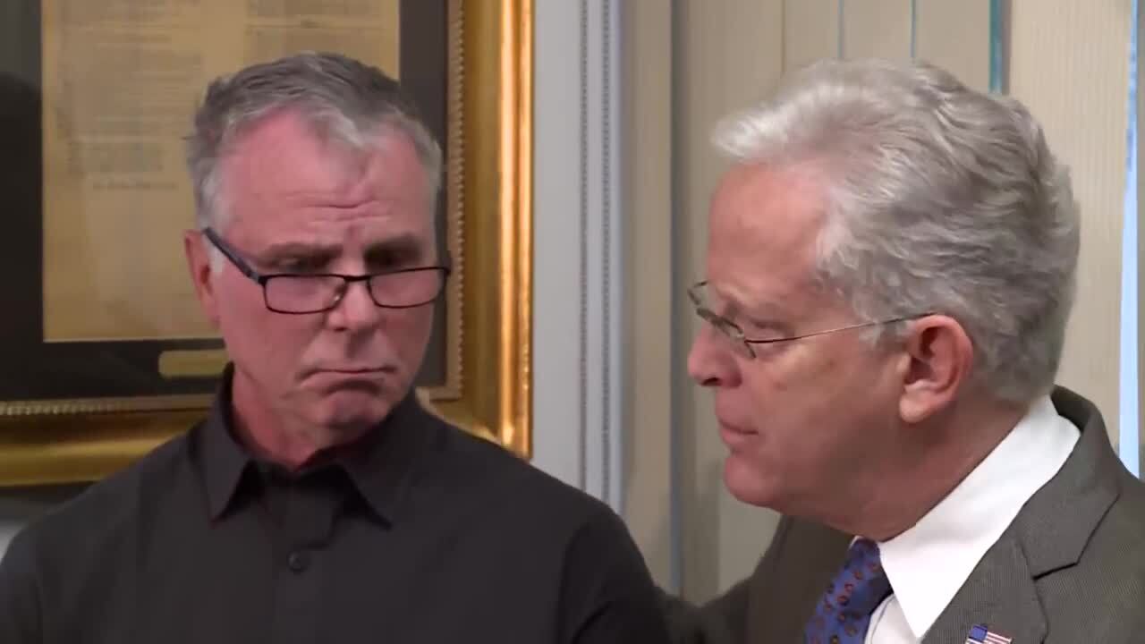 Gary Lesser consoles Bill Serge, son of woman killed by alligator while walking dog