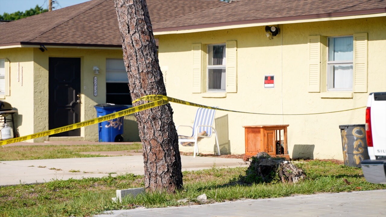 Crime scene tape outside the Pine Manor home.
