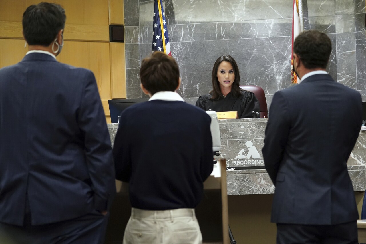 Judge Elizabeth Scherer talks to Nikolas Cruz as he pleads guilty with his lawyers, Oct. 15, 2021