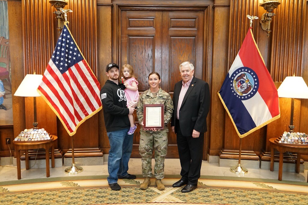 CREDIT RACHEL TOZIER with family meeting Parson.jpg