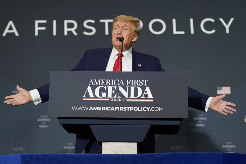 Former President Donald Trump speaks at a podium