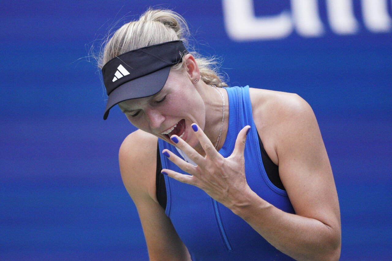 Caroline Wozniacki, of Denmark, reacts during her match against Coco Gauff, of Delray Beach, during the fourth round of the U.S. Open tennis championships, Sunday, Sept. 3, 2023, in New York. (AP Photo/Eduardo Munoz Alvarez)