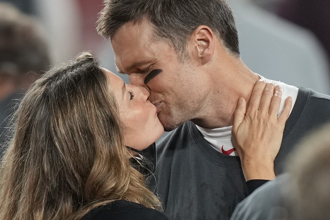 Tom Brady and Gisele Bundchen kiss after Tampa Bay Buccaneers win Super Bowl LV, Feb. 7, 2021