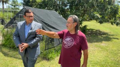 Hamid Salahutdin shows Adam Walser where the easement crosses through his 10 acre property