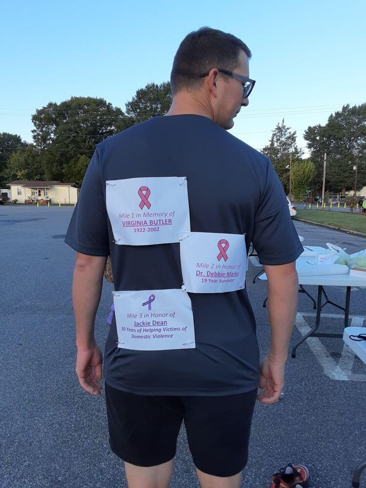 Hopewell man walks 5K in five-inch heels to raise awareness for domestic violence, breast cancer