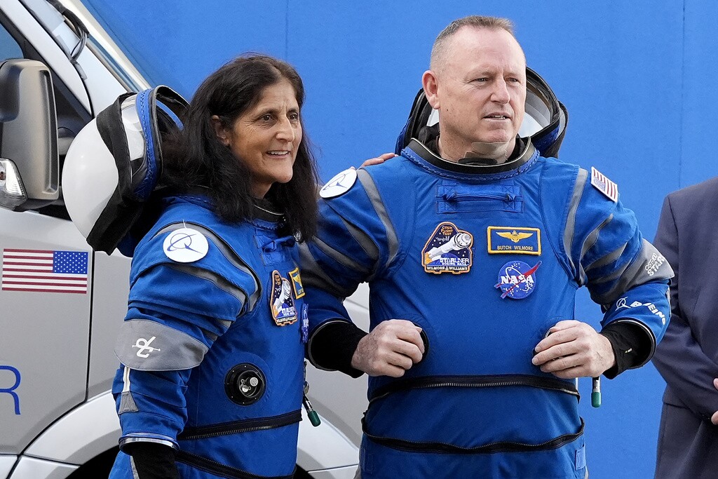 ASA astronauts Suni Williams, left, and Butch Wilmore, right