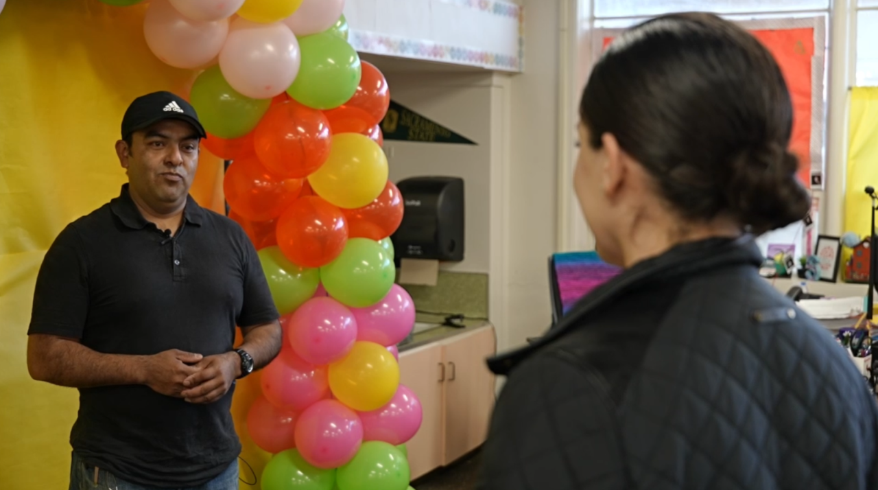 Neighborhood News Reporter Priscilla Lara interviewing Roberto Garcia, a parent taking part in the Latino Family Literacy Project