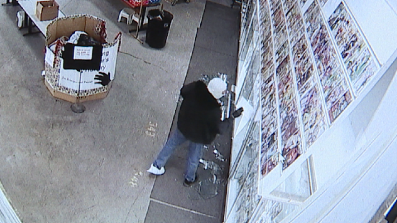 An unknown thief stealing comics