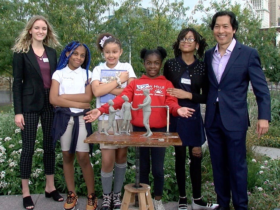 Sculptors_and_girls_with_Spencer_statue_model.jpg