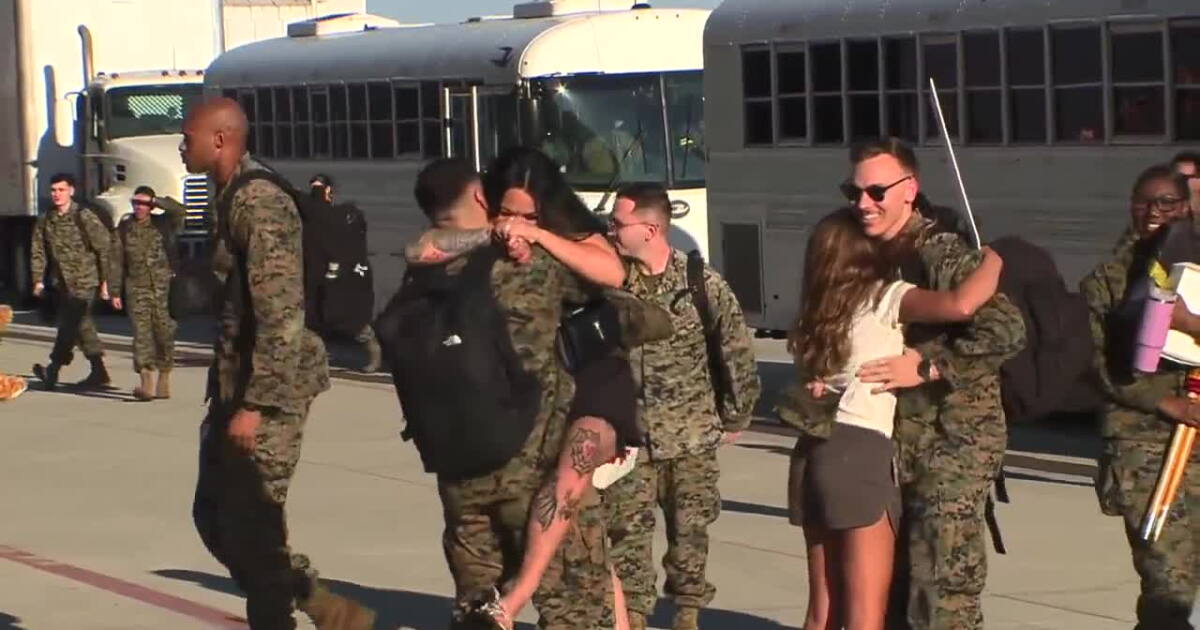 Marines welcomed home with open arms & plenty of love after deployment with Lincoln Strike Group