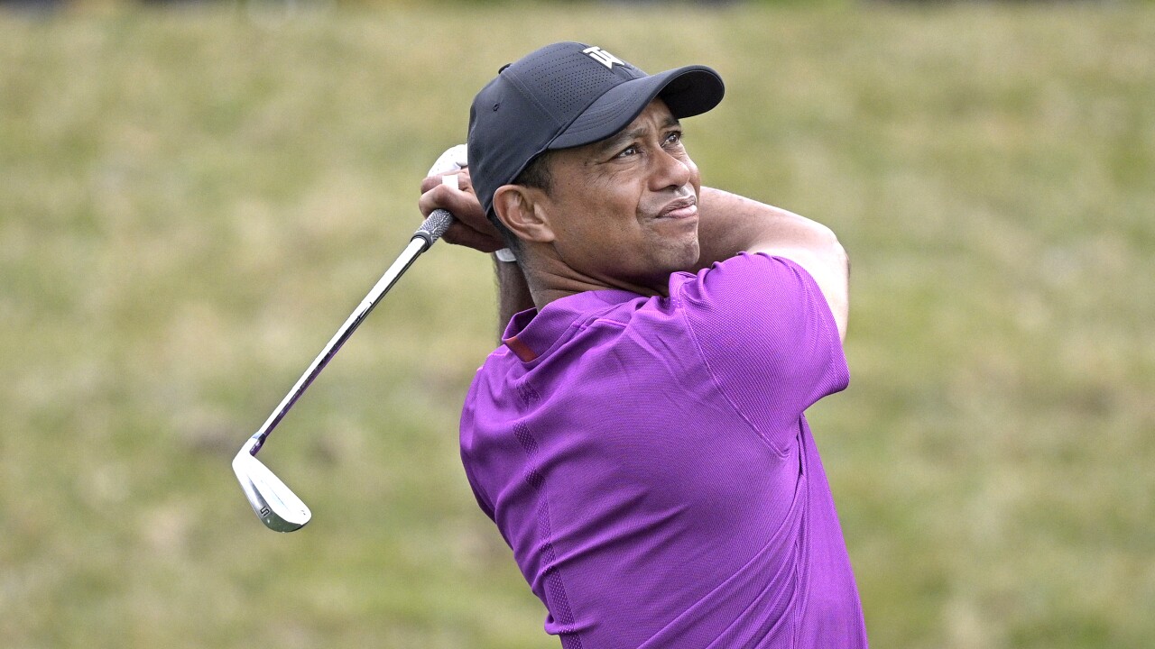 Tiger Woods watches tee shot on 17th hole at 2020 PNC Championship