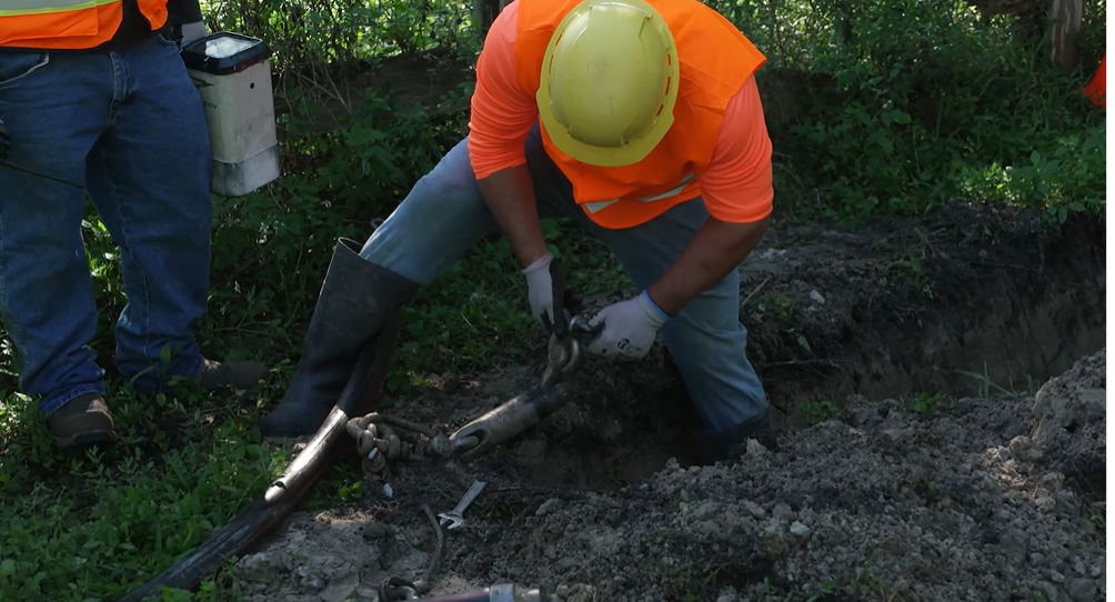 FPL worker lays underground power lines in Jupiter Farms area. Feb. 24, 2024.png