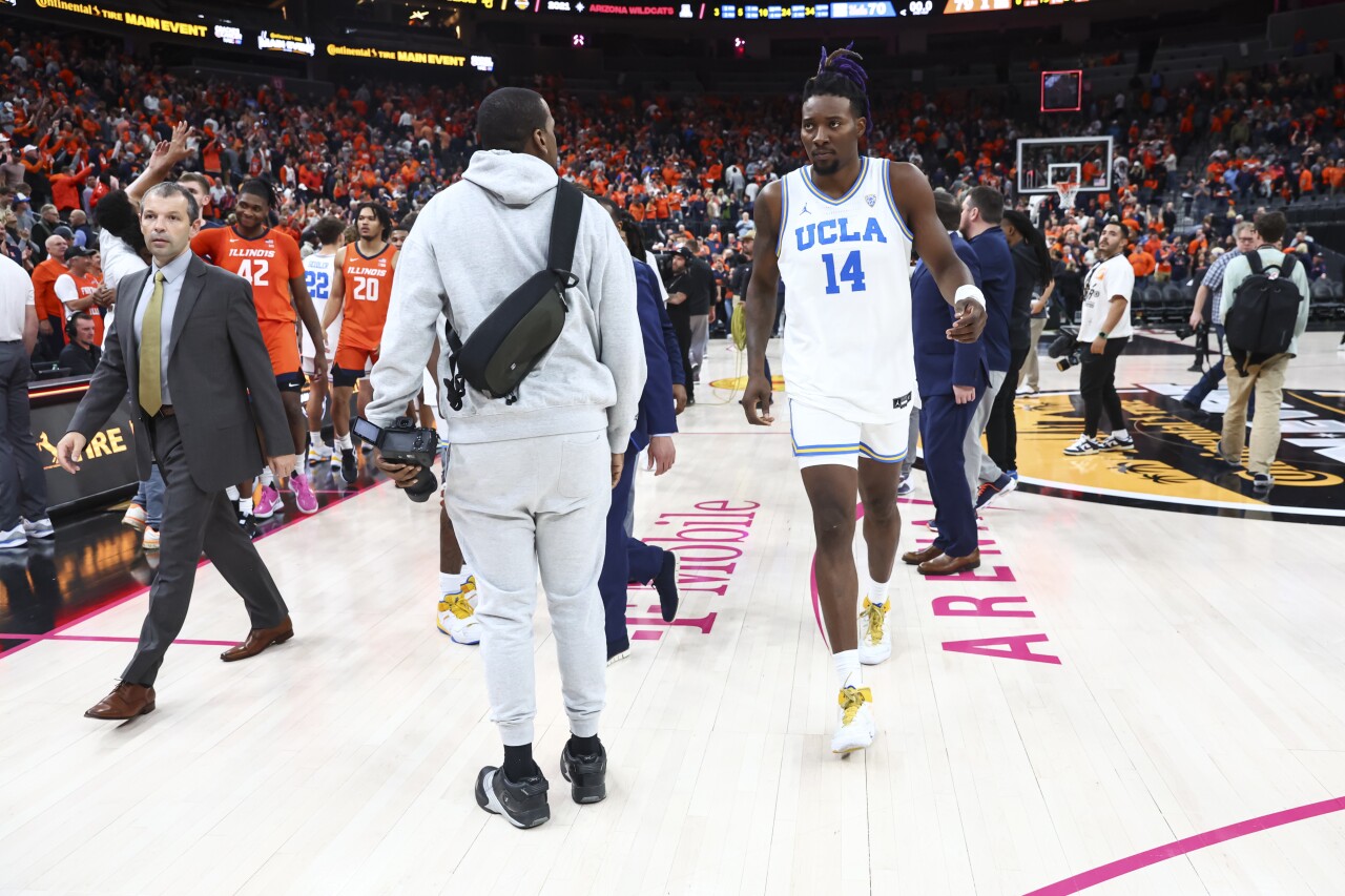 UCLA forward Kenneth Nwuba walks off court at T-Mobile Arena after losing to Illinois, Nov. 18, 2022
