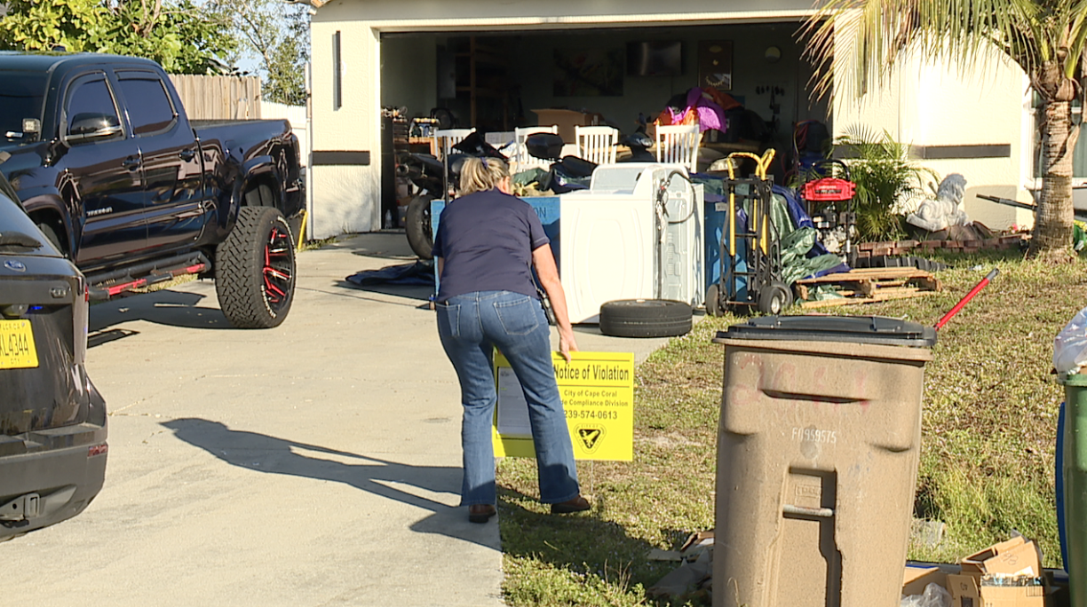 Woman putting in a sign