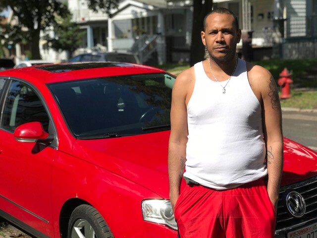christopher with car.jpg