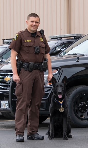 Deputy Crosby and K9 Blek with Medal.jpg
