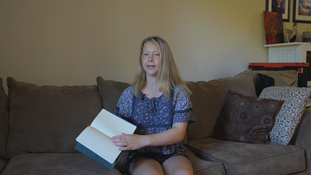 Evelyn Yuhasz explaining a two-notebook vs. a four-notebook leather journal