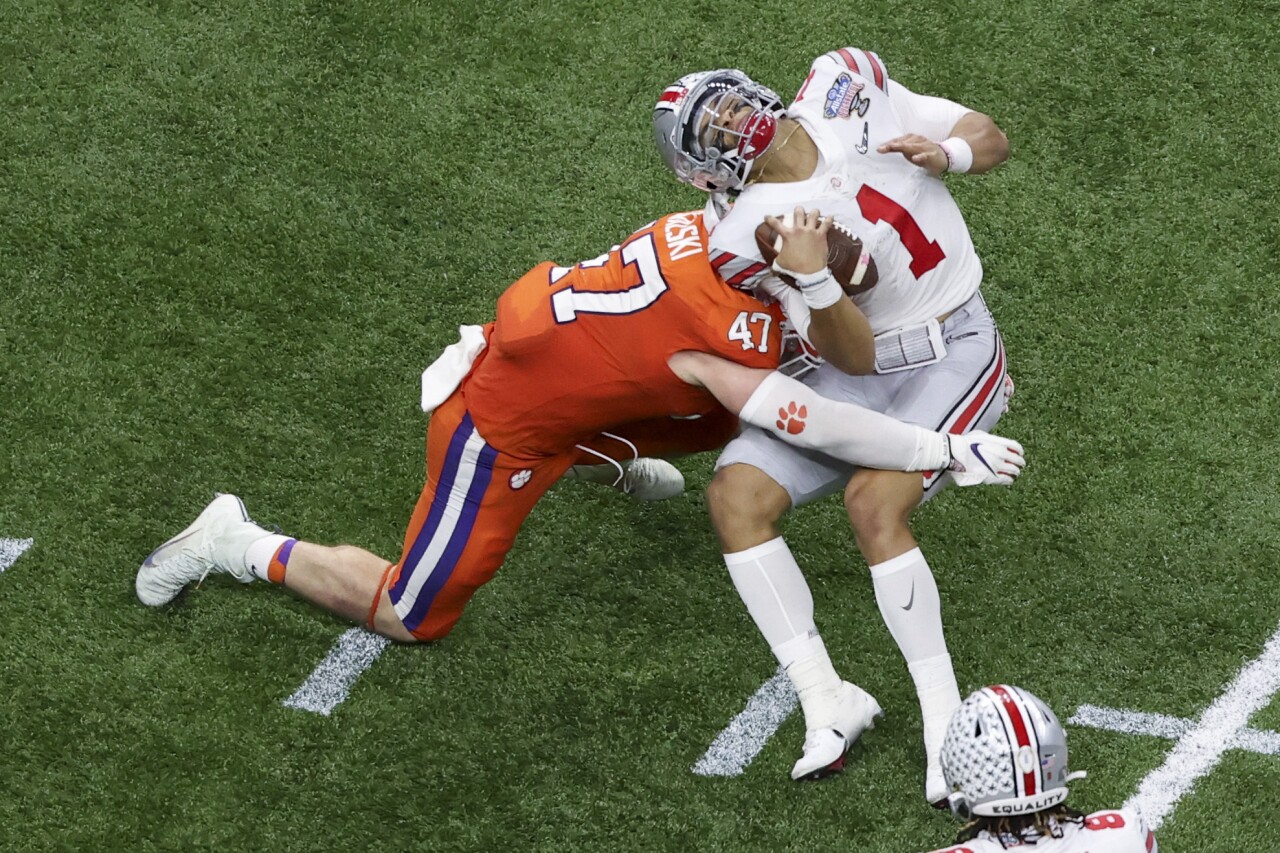 Clemson Tigers linebacker James Skalski hits Ohio State Buckeyes QB Justin Fields in College Football Playoff at Sugar Bowl
